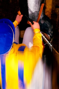 Jockey riding his horse on a running track