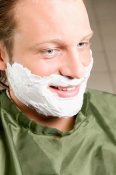 Man getting shaved in a salon
