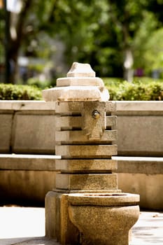 Damaged fountain in a park, Madrid, Spain