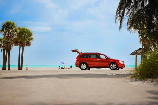 Red car on the beach