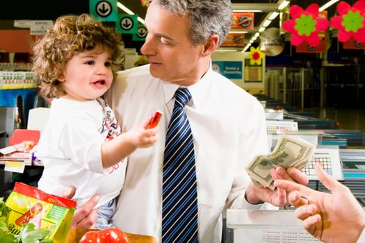 Customers making payments at the checkout counter