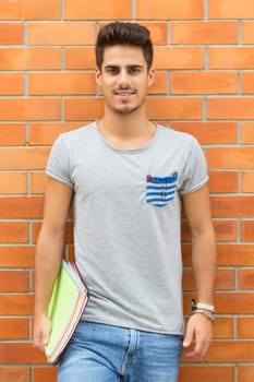 Happy student relaxing at the university campus