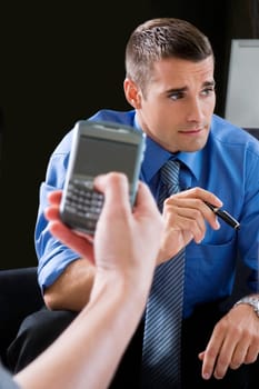 Close_up of a personŽs hand using a palmtop