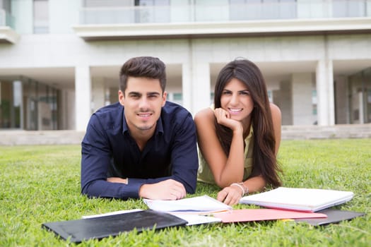 Couple of happy students at the university campus