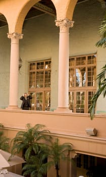 Businessman standing in the balcony, Biltmore Hotel, Coral Gables, Florida, USA