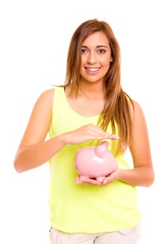 A teenager holding a piggy bank (money box) - savings concept