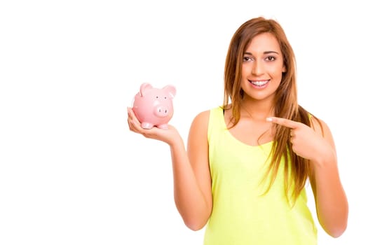 A teenager holding a piggy bank (money box) - savings concept