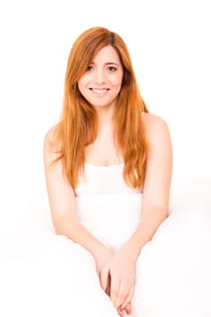 Young happy beautiful woman moments after waking up
