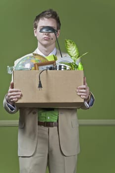 Fired businessman holding his office belongings