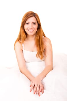 Young happy beautiful woman moments after waking up
