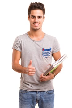 Young happy student posing isolated over white background