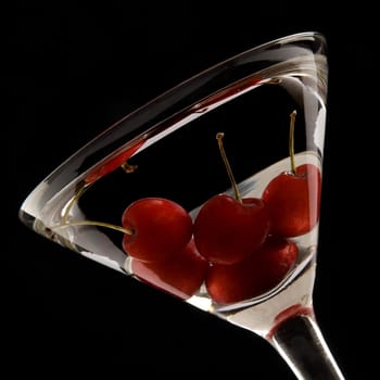 Close_up of cherries in a martini glass
