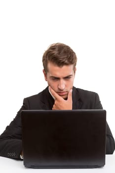 Young handsome man working with laptop computer