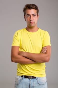 Studio picture of a young and handsome man posing isolated
