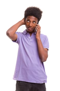 Young african boy at the phone, isolated over white