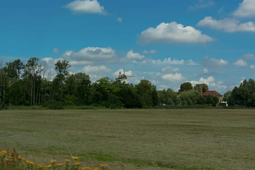 Countryside panorama blue sky Windmill in the background