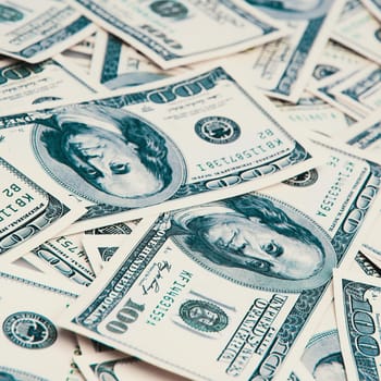 A hundred American banknotes are scattered. cash hundred-dollar bills, dollar background image.