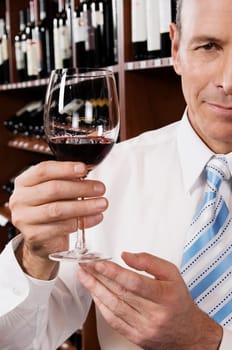 Businessman holding a wine glass