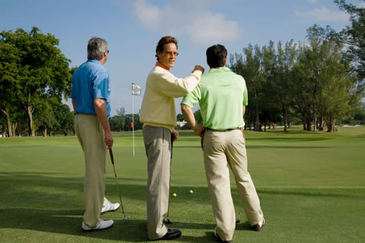 Three golfer standing in a golf course, Biltmore Golf Course, Coral Gables, Florida, USA