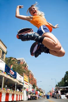 Low angle view of a young woman jumping