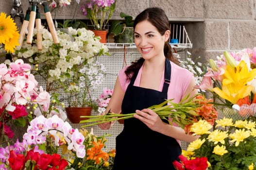 Woman holding a bouquet of flowers and smiling