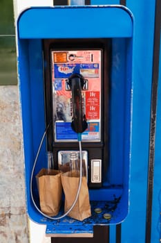 Close_up of a coin operated telephone booth