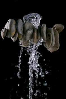 Water dripping from pebbles