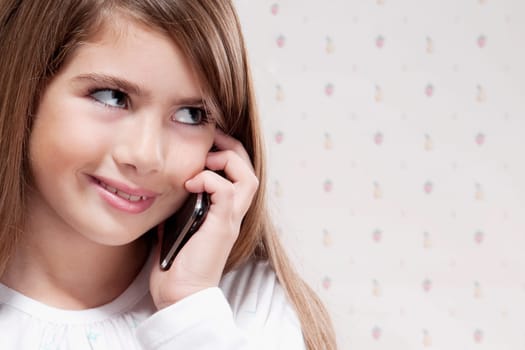 Close_up of a girl talking on a mobile phone