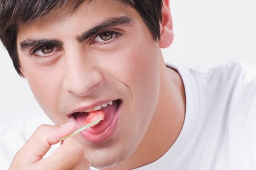 Close_up of a man eating an ice cream