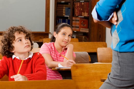 Students with their teacher in a classroom