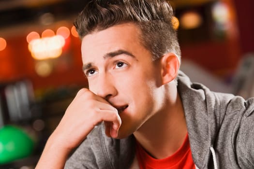 Close_up of a young man thinking