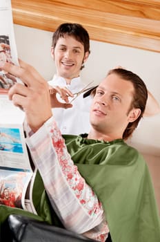 Man receiving a haircut in a salon