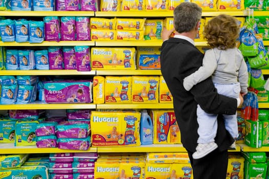 Man shopping with his grandson in a supermarket