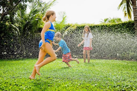 Three friends playing in a lawn