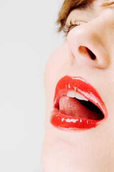 Close_up of a young woman with her mouth open