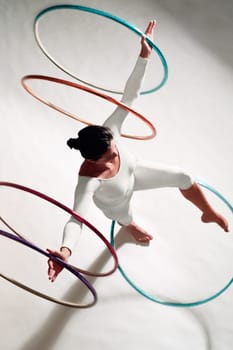 High angle view of a woman exercising with hula hoops