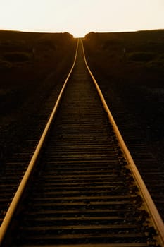 Railroad track passing through a landscape