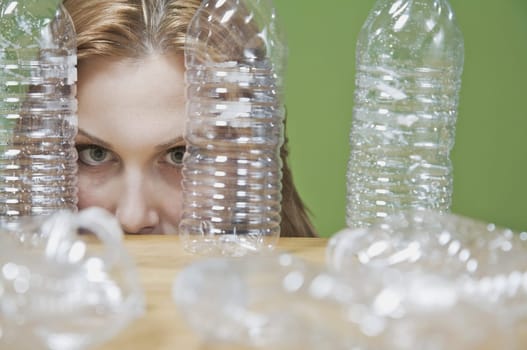 Portrait of a woman looking through bottles