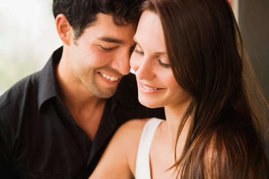 Close_up of a young couple smiling