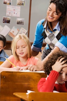Students with their teacher in a classroom