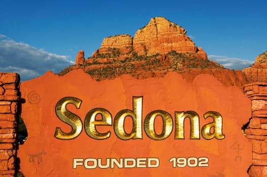 Text on a stone wall with rock formations in the background, Sedona, Arizona, USA