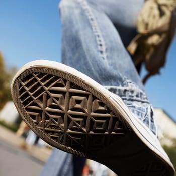 Close_up of a person showing his shoe