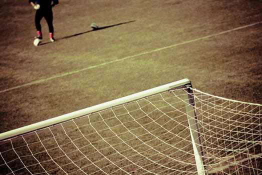 Soccer player standing in a field