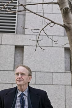 Businessman standing in front of a building