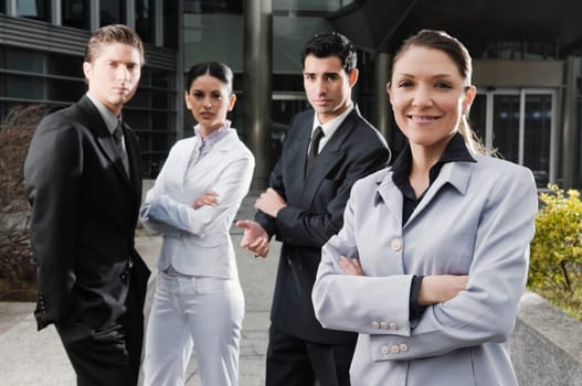 Four business executives standing together