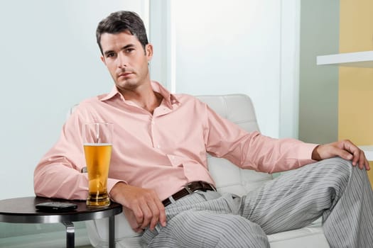 Portrait of a mid adult man with a glass of beer