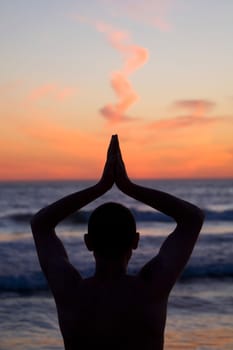 Man practicing yoga on the beach, Santa Monica, Los Angeles County, California, USA