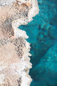 High angle view of a natural geyser, Old Faithful, Upper Geyser Basin, Yellowstone National Park, Wyoming, USA