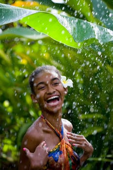 Close_up of a woman enjoying rain shower