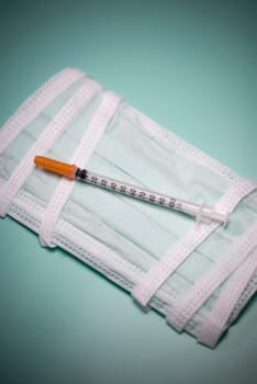 Close_up of a syringe on a bandage